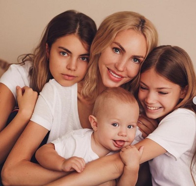 Zhenya Kotova with her mother and siblings